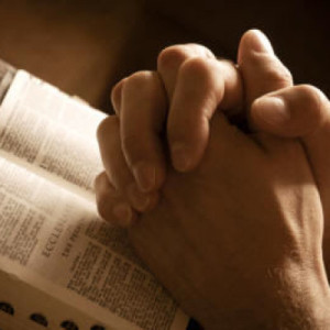 Praying-Hands-over-Bible-400x400